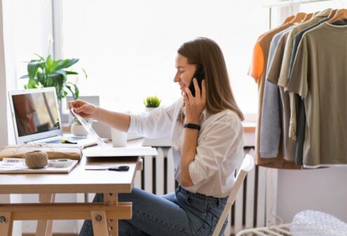 medium-shot-woman-sitting-desk